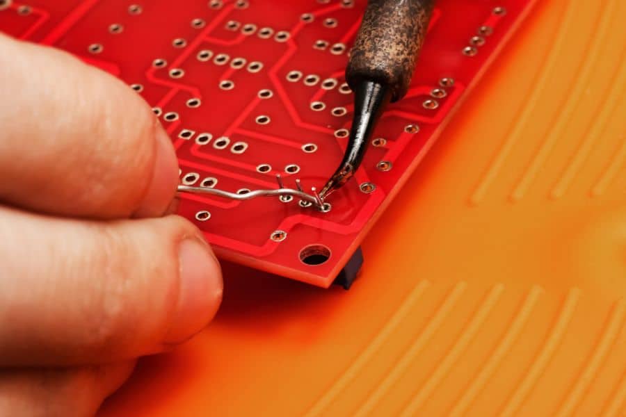 Self-Manufacturing Low Cost PCB Prototypes - Soldering on a Red PCB